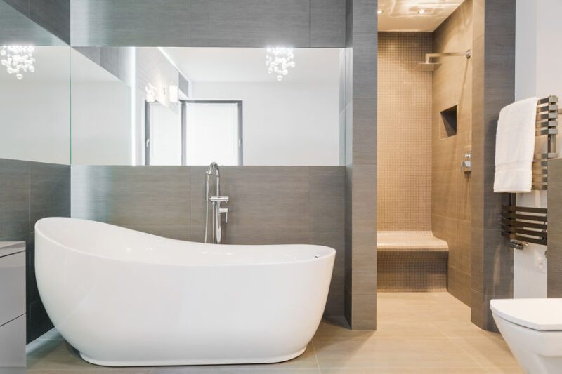 Photo of big new design bathtub in spacious trendy bathroom