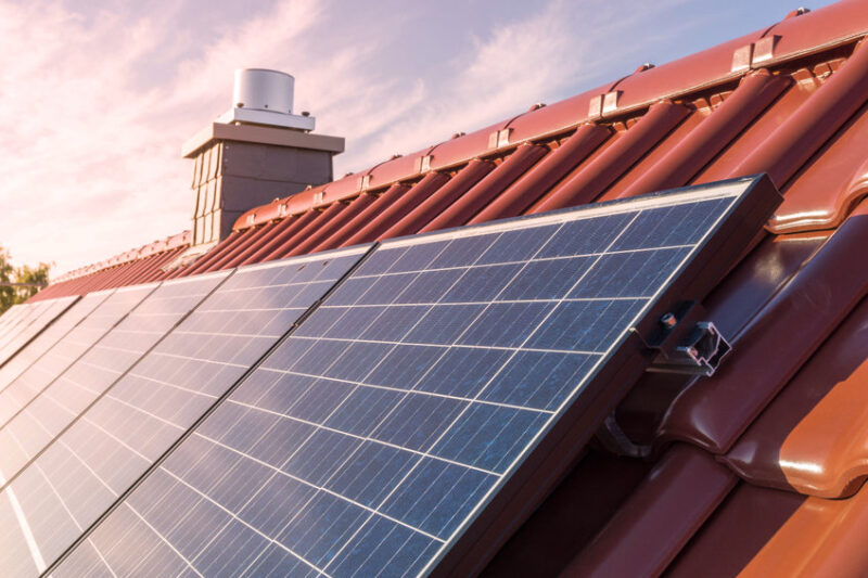 Solar panels or photovoltaic power plant on the roof of a house