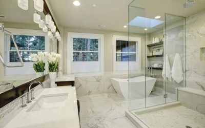 Amazing white and gray marble master bathroom with large glass walk-in shower, freestanding tub and skylights on the ceiling. Northwest, USA